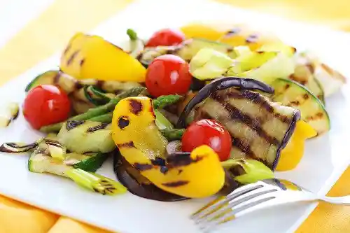 Grilled vegetables on a white plate