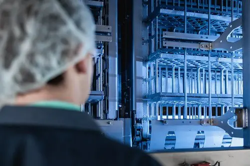 Worker looking at a piece of equipment
