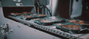 CPET trays with product going into a CircFood Spiral Oven image