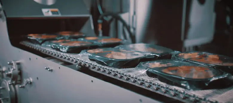 CPET trays with product going into a CircFood Spiral Oven image